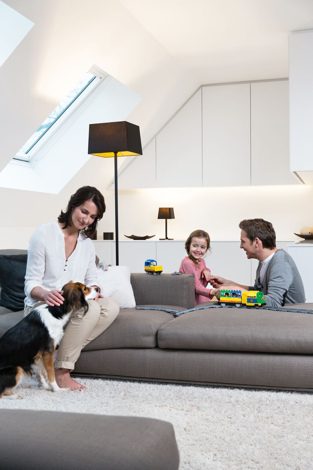 family at home ready to watch a movie on a projection screen
