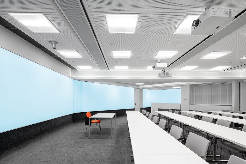 bright conference room with P-VIPprojectors and projection screens