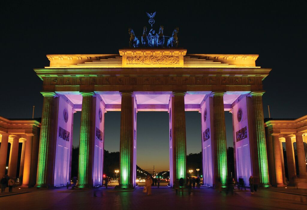 Brandenburg gate illuminated with colorful architectural lighting